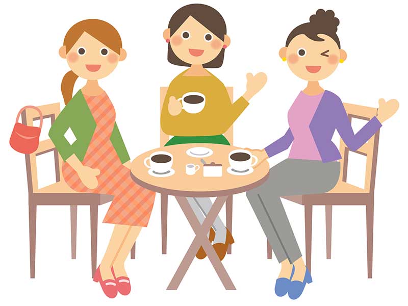 レストランの席に座る女性たち